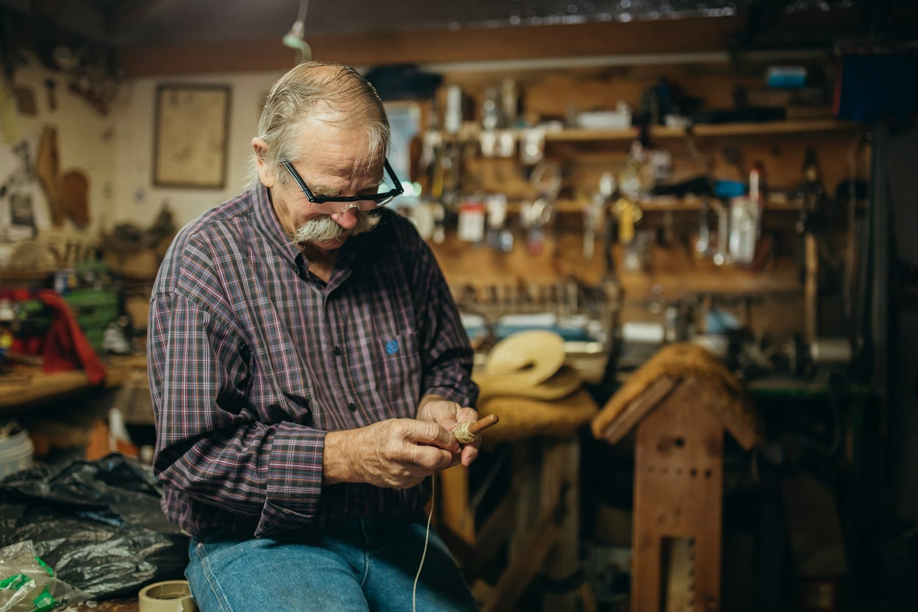 Leather craftsman working at Magnus Leathers